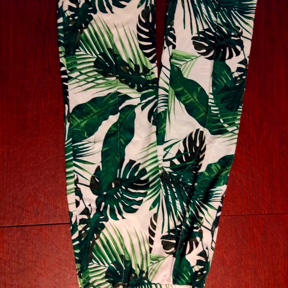 Casual but dressy pants for women. Has a leaf print pattern and is flared styled